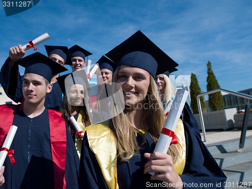 Image of young graduates students group