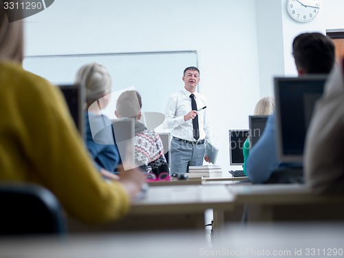 Image of students with teacher  in computer lab classrom