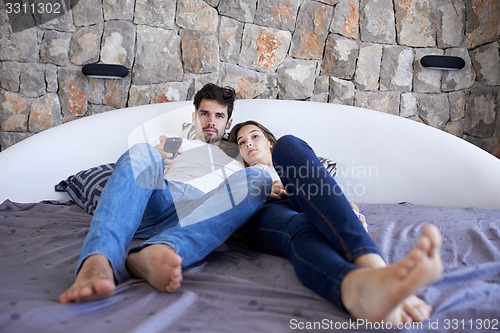 Image of couple relax and have fun in bed