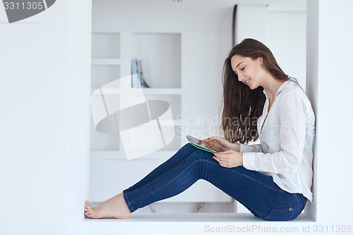 Image of woman at home using tablet