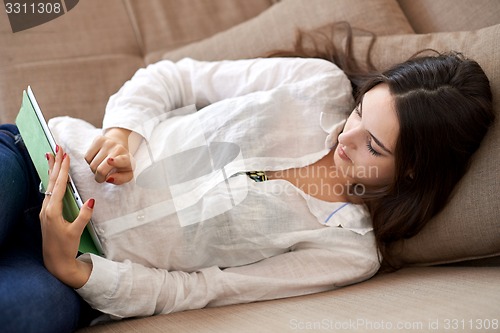 Image of woman at home using tablet