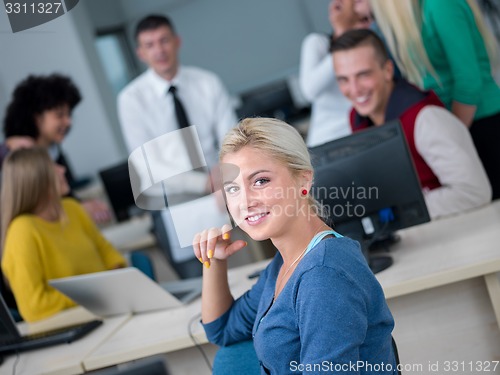 Image of students with teacher  in computer lab classrom