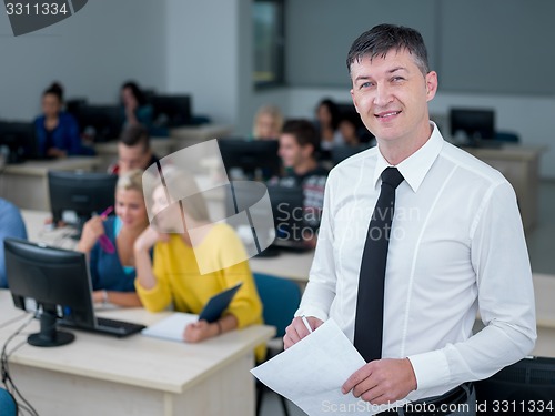 Image of students with teacher  in computer lab classrom