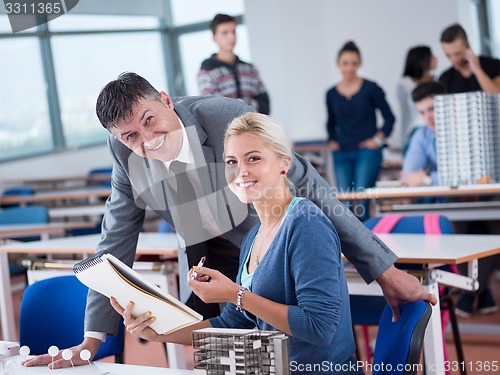 Image of students with teacher  in computer lab classrom