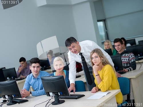 Image of students with teacher  in computer lab classrom