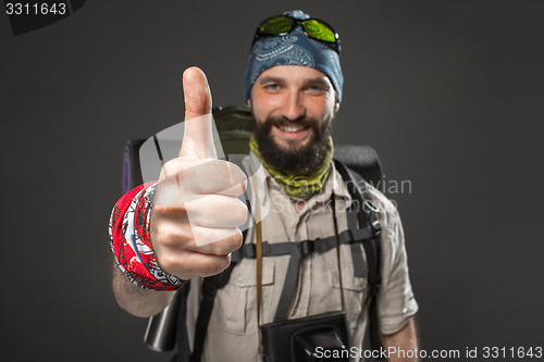Image of Portrait of a smiling male fully equipped tourist 