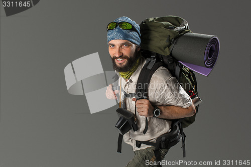 Image of Portrait of a smiling male fully equipped tourist 