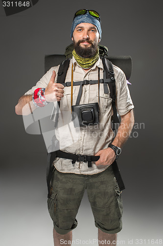 Image of Portrait of a smiling male fully equipped tourist 