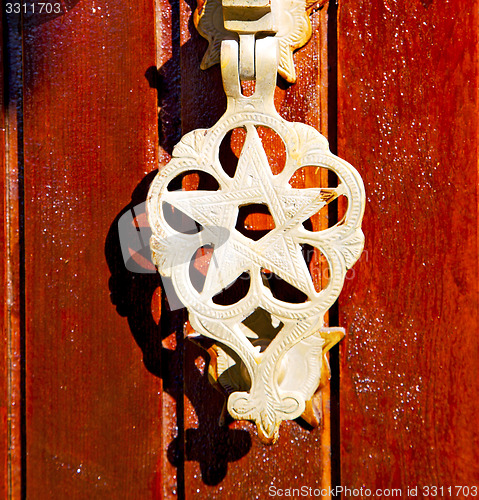 Image of metal rusty  brown    morocco in africa gold  padlock 