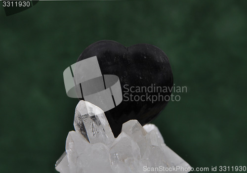 Image of Obsidian on rock crystal