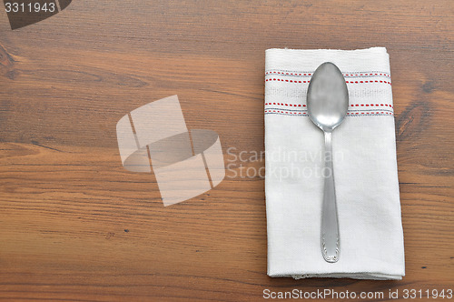 Image of Old spoon on cloth