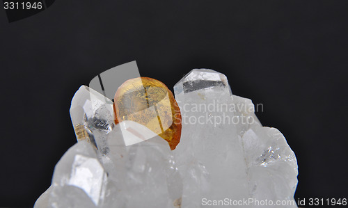 Image of Amber on rock crystal