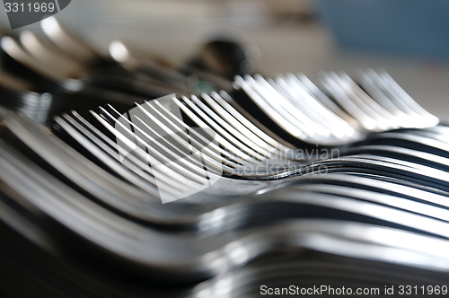 Image of Forks on the kitchen counter.