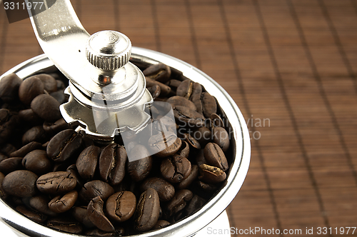 Image of Coffee grinder on the table.