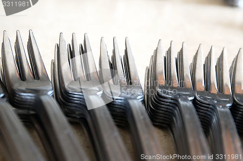 Image of Forks on the kitchen counter.