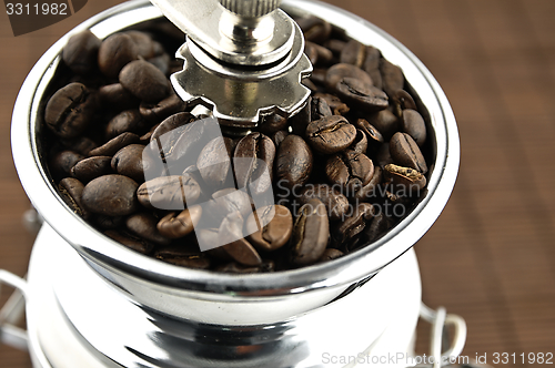 Image of Coffee grinder on the table.