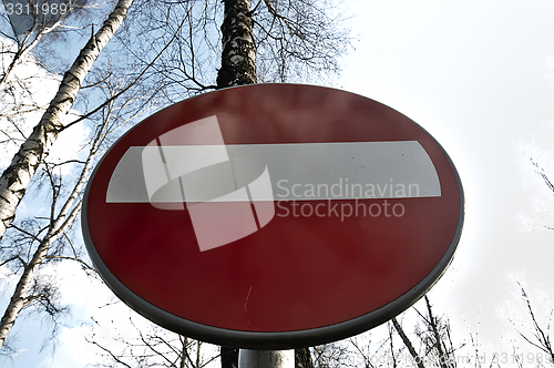 Image of No-entry sign against the sky.