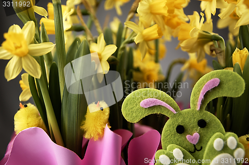 Image of Easter bunny and yellow daffodils.