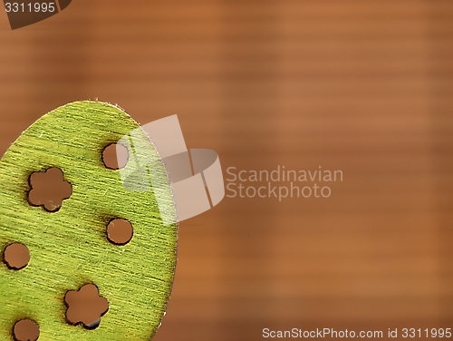 Image of Easter decoration - green wooden egg.