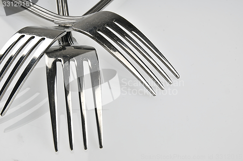 Image of Forks arranged in series on the kitchen table.