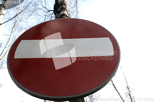Image of No-entry sign against the sky.