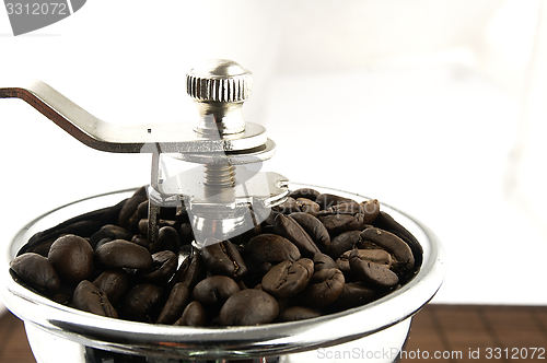 Image of Coffee grinder on the table.