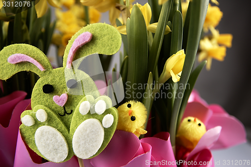 Image of Easter bunny and yellow daffodils.