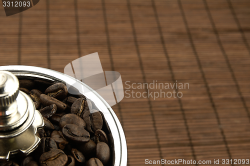 Image of Coffee grinder on the table.