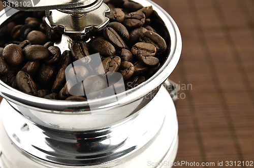 Image of Coffee grinder on the table.