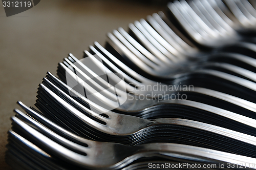 Image of Forks on the kitchen counter.