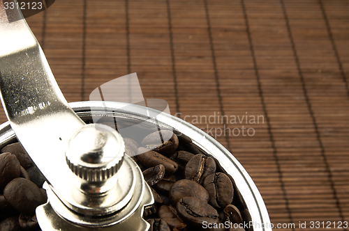 Image of Coffee grinder on the table.