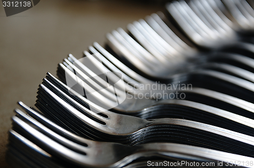 Image of Forks on the kitchen counter.