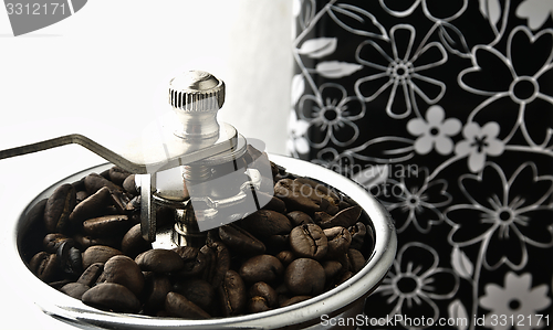 Image of Coffee grinder on the table.