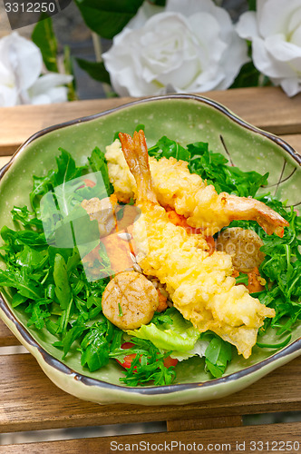 Image of fresh Japanese tempura shrimps with salad