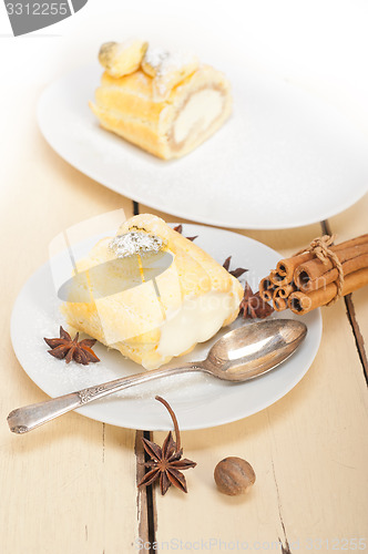 Image of cream roll cake dessert and spices 