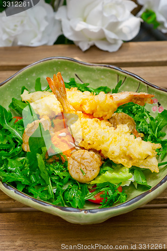 Image of fresh Japanese tempura shrimps with salad