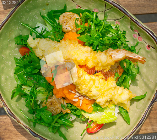 Image of fresh Japanese tempura shrimps with salad