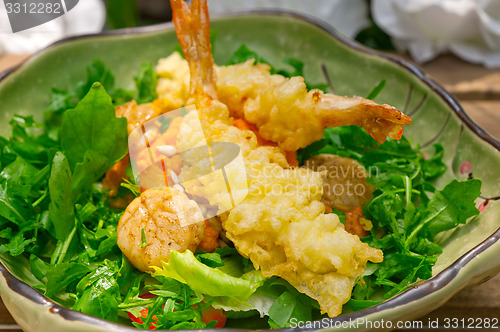 Image of fresh Japanese tempura shrimps with salad