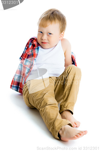 Image of Funny blue-eyed three-year boy on a white background