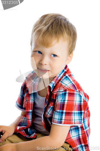 Image of Funny blue-eyed three-year boy on a white background