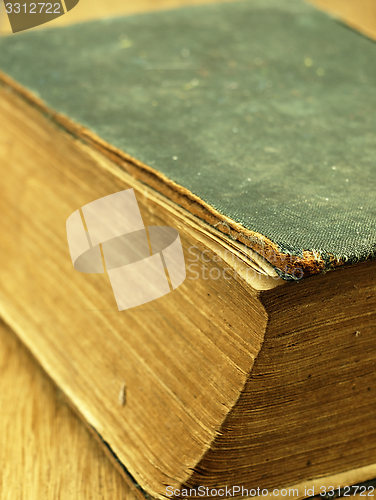 Image of Old closed the book with a damaged cover.