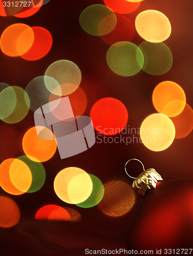 Image of Red Christmas Tree bauble and magic bokeh.