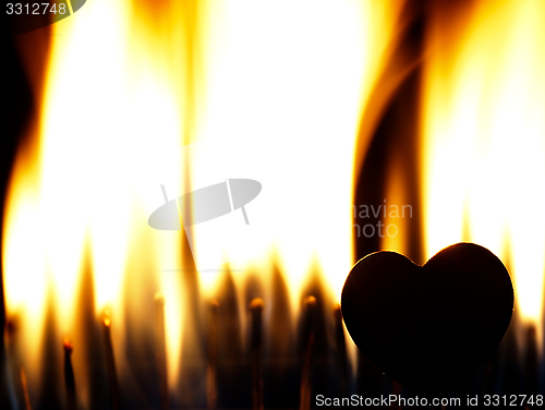 Image of Flaming heart on a black background.