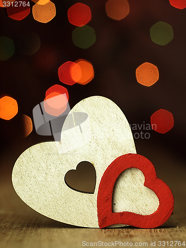 Image of Heart\'s on a wooden boards background.