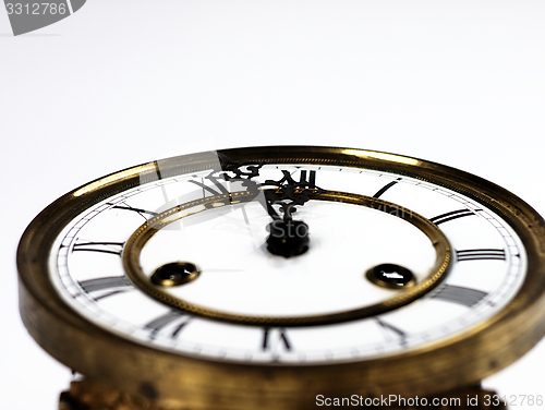 Image of Old clock with roman numerals.