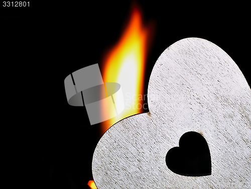 Image of Flaming heart on a black background.