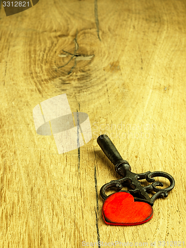 Image of Old metal key and red heart.