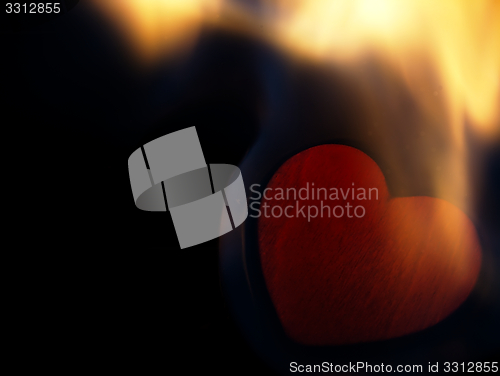 Image of Flaming heart on a black background.