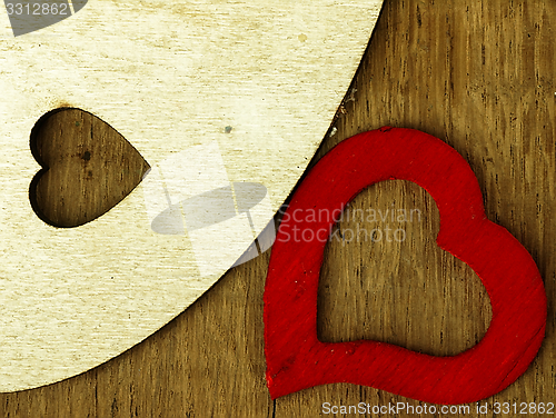 Image of Wooden heart on the oak table.