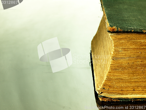 Image of Old closed the book with a damaged cover.